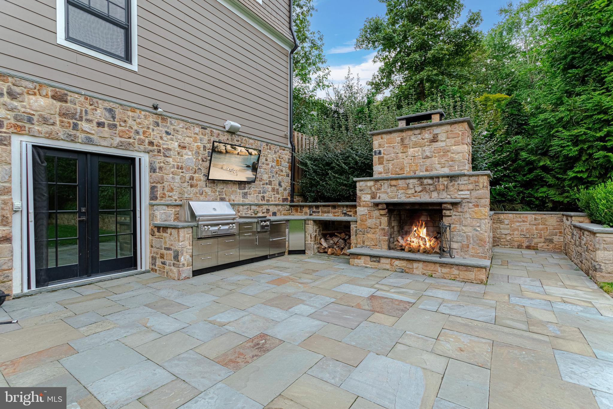 1478 Waggaman Circle McLean, VA 22101 - Photo 44 of 50 Stone fireplace with outdoor TV