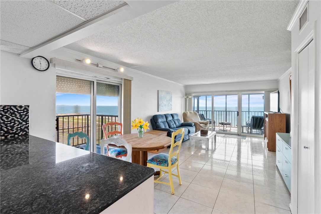 202 Reef Avenue, Unit 407 Corpus Christi, TX 78402 - Photo 5 of 32 Open concept. Sliding glass door opens to a balcon