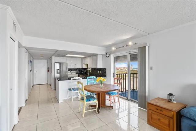 a view of a dining room with furniture and a livingroom