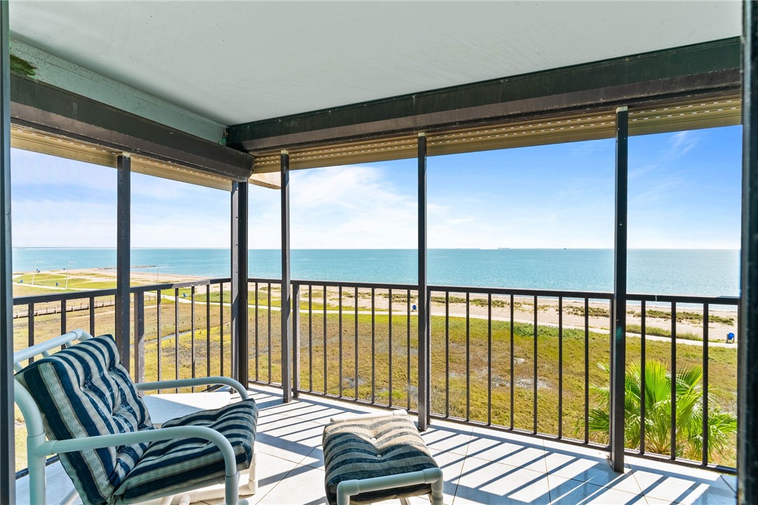 202 Reef Avenue, Unit 407 Corpus Christi, TX 78402 - Photo 10 of 32 Balcony off of living area and Primary bedroom wit