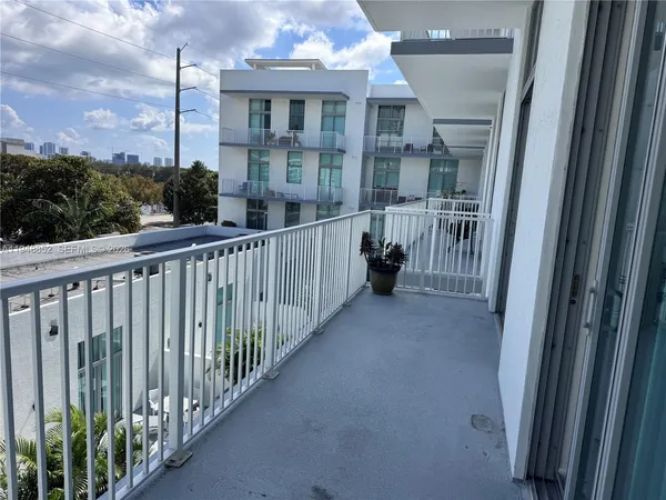 a view of a house with a small yard