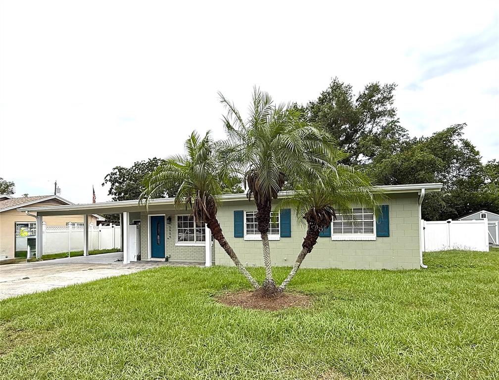 2924 Conway Gardens Road Orlando, FL 32806 - Photo 1 of 36 a house that has a tree in front of it