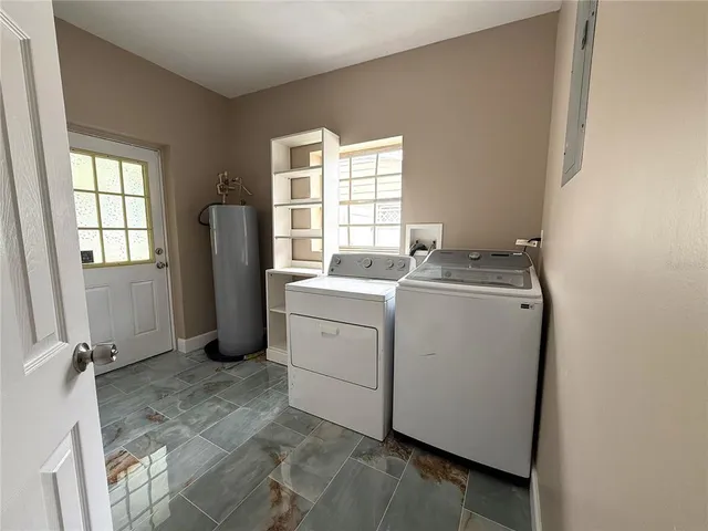a view of a storage & utility room with washer and dryer