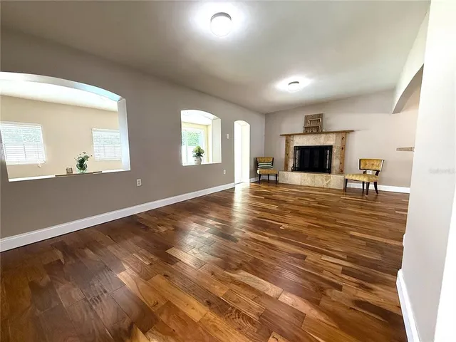 an empty room with windows and table