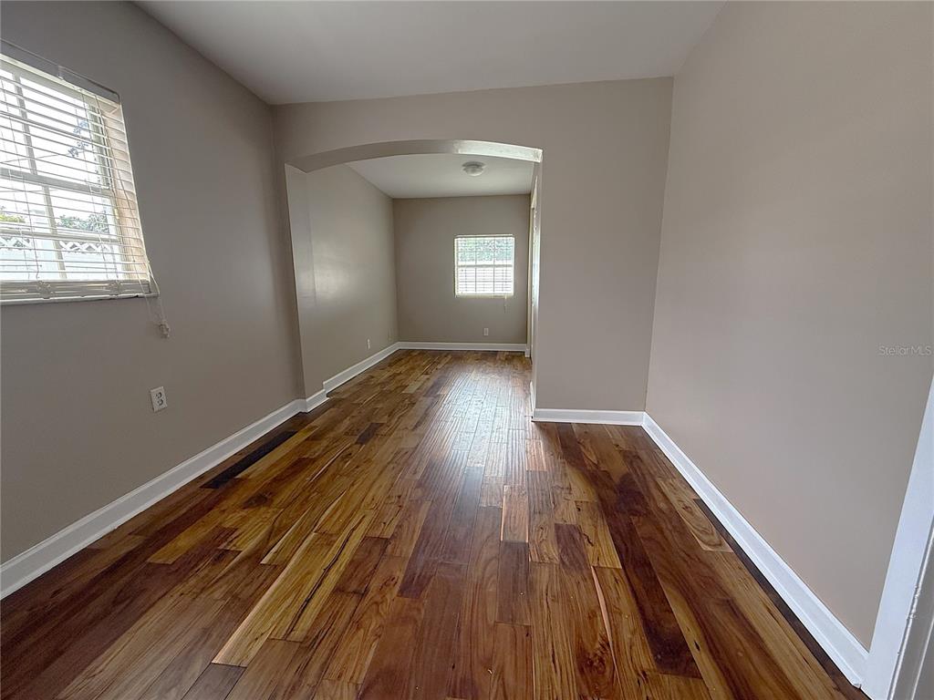2924 Conway Gardens Road Orlando, FL 32806 - Photo 18 of 36 a view of a room with wooden floors and window