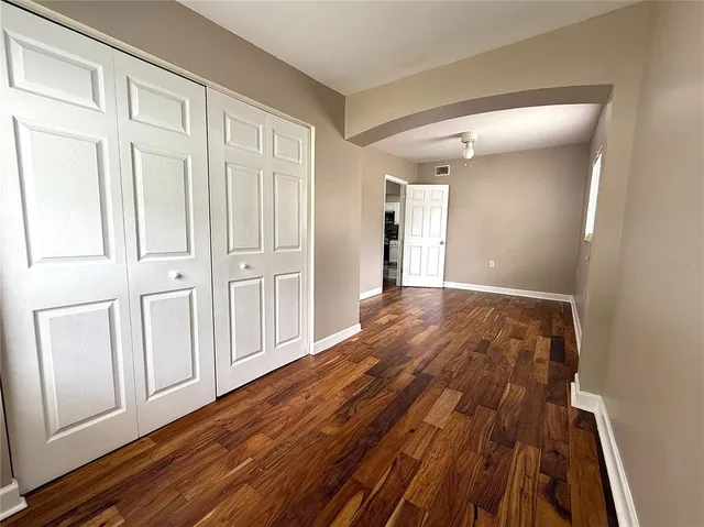 a view of a livingroom with wooden floor