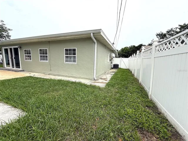 a backyard of a house with lots of green space
