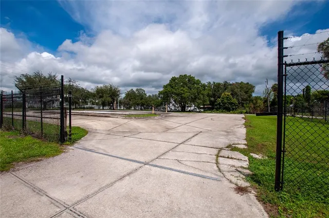 a view of a pathway with a yard