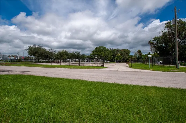 a view of a swimming pool and a yard
