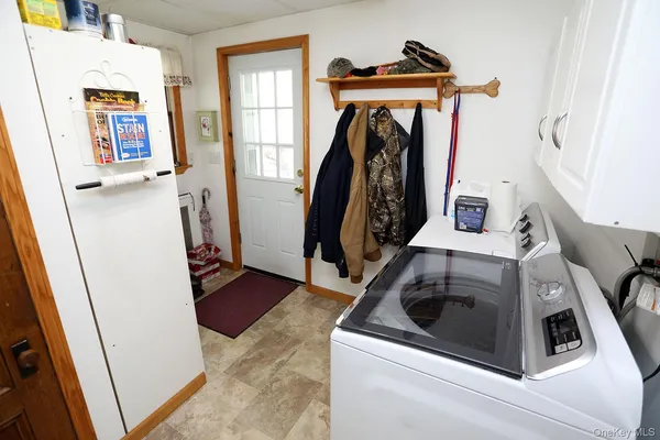 a view of backyard with wooden fence