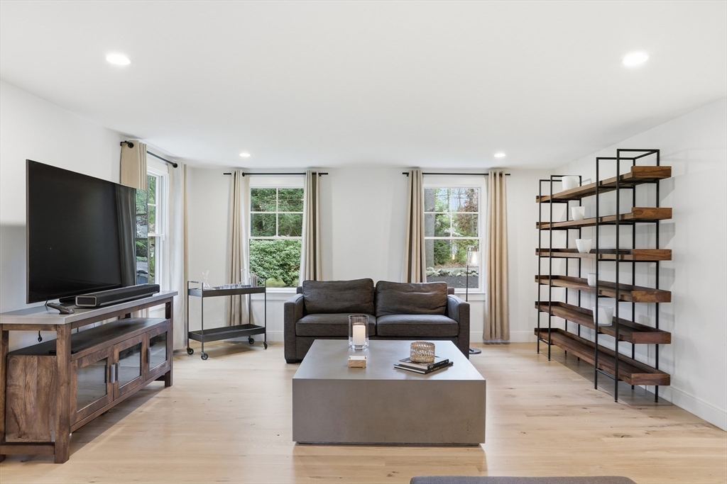 136 Holden Wood Road Concord, MA 01742 - Photo 6 of 31 a living room with furniture and a flat screen tv