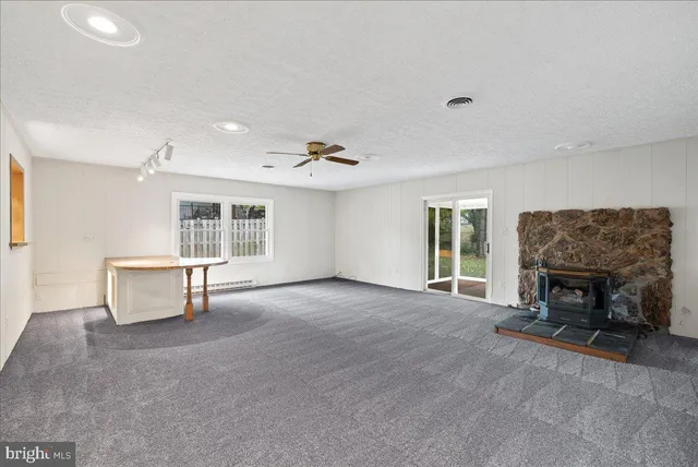 a view of livingroom with furniture and a fireplace