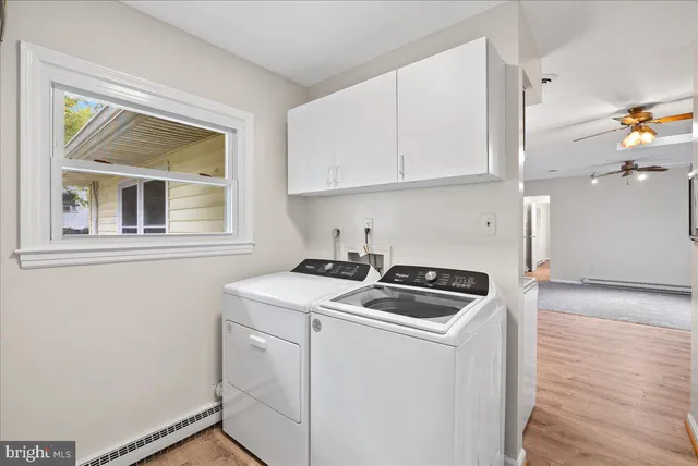 a kitchen that has a stove and a microwave