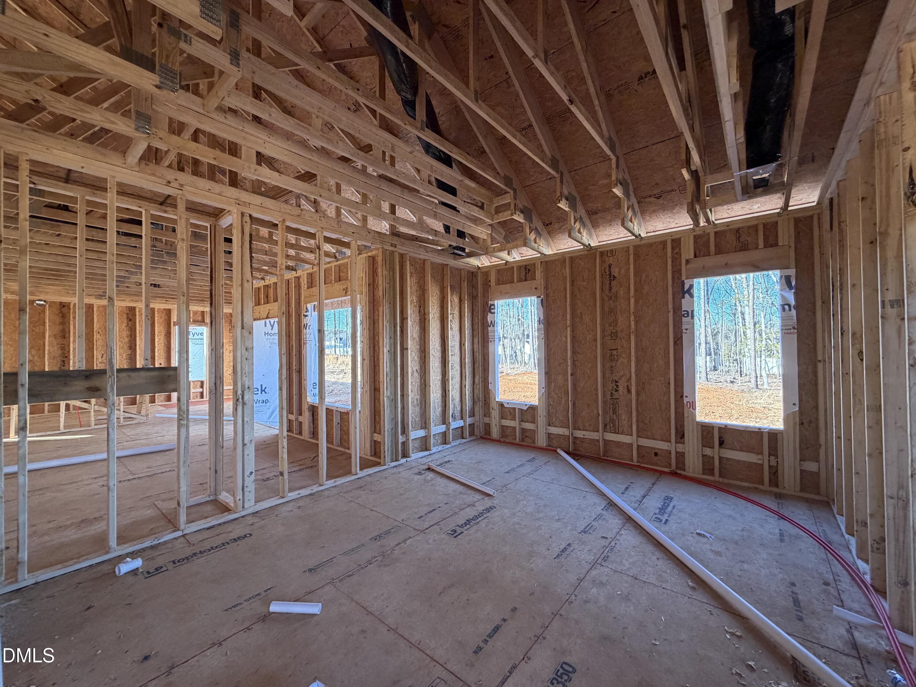 259 Seahawk Way Zebulon, NC 27597 - Photo 5 of 6 a view of an empty room with windows