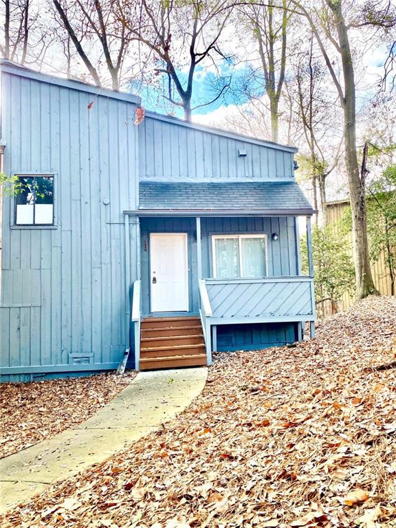 a front view of a house with a wooden fence
