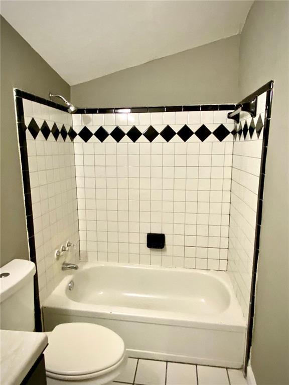 5840 Par Four Court Lithonia, GA 30038 - Photo 19 of 27 a bathroom with a bathtub a sink and a shower