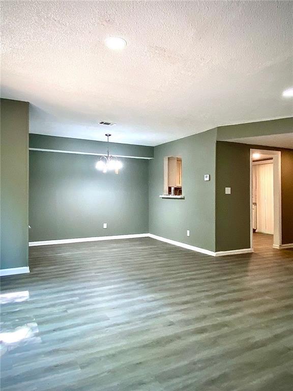 5840 Par Four Court Lithonia, GA 30038 - Photo 3 of 27 a view of an empty room with window and wooden floor