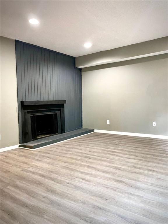 5840 Par Four Court Lithonia, GA 30038 - Photo 5 of 27 a view of empty room with wooden floor and fireplace