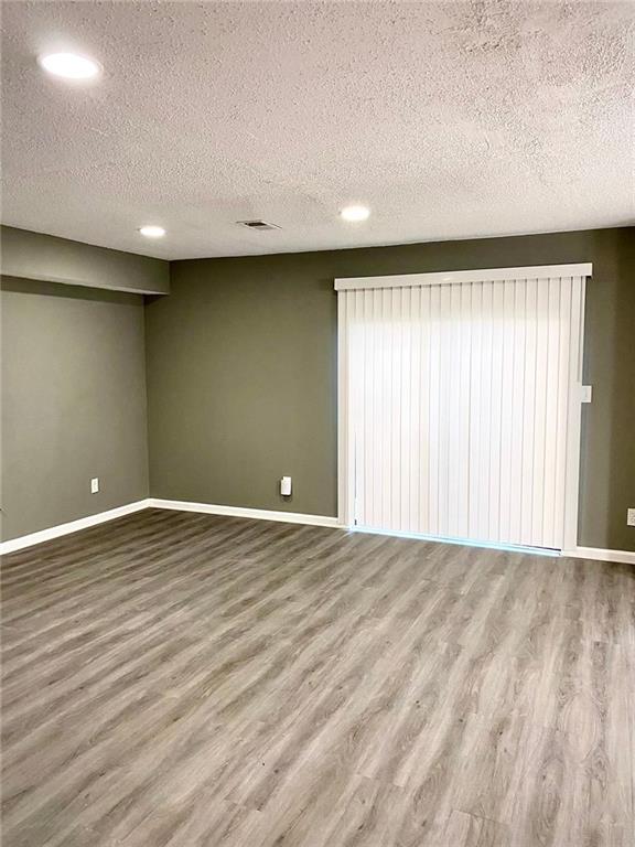 5840 Par Four Court Lithonia, GA 30038 - Photo 6 of 27 a view of an empty room with wooden floor