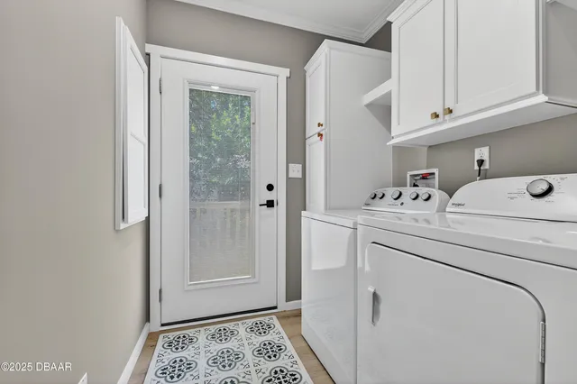 a view of a house with a big yard and large trees
