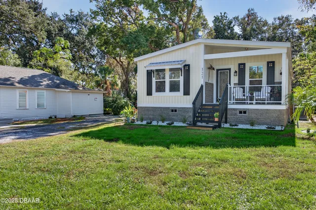 a aerial view of a house with swimming pool and garden