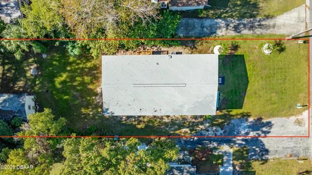 an aerial view of a houses with a lake view