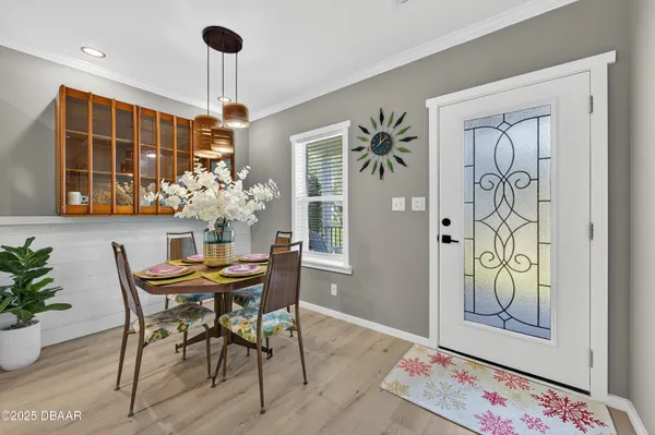 a view of a dining room with furniture and window