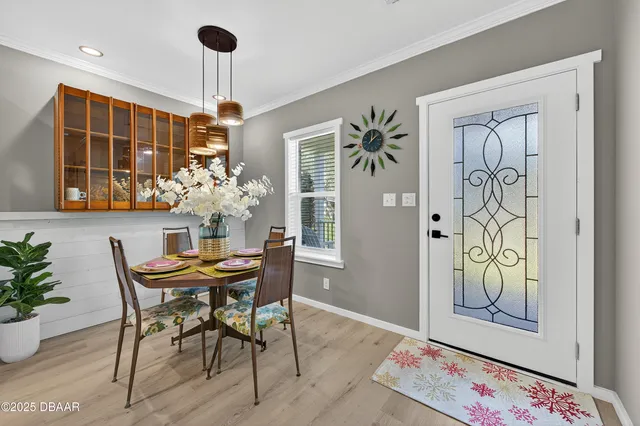a view of a dining room with furniture and window