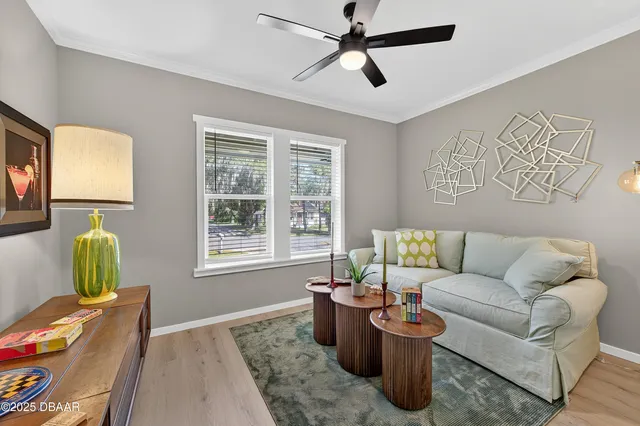 a living room with furniture and a window