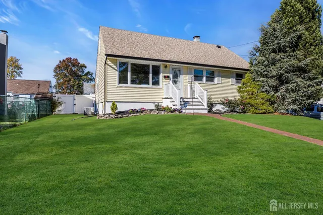a front view of a house with a yard and porch