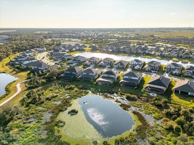 a view of entryway with wooden floor and windows