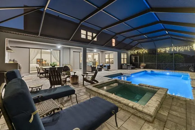 a view of a workspace with furniture and wooden floor