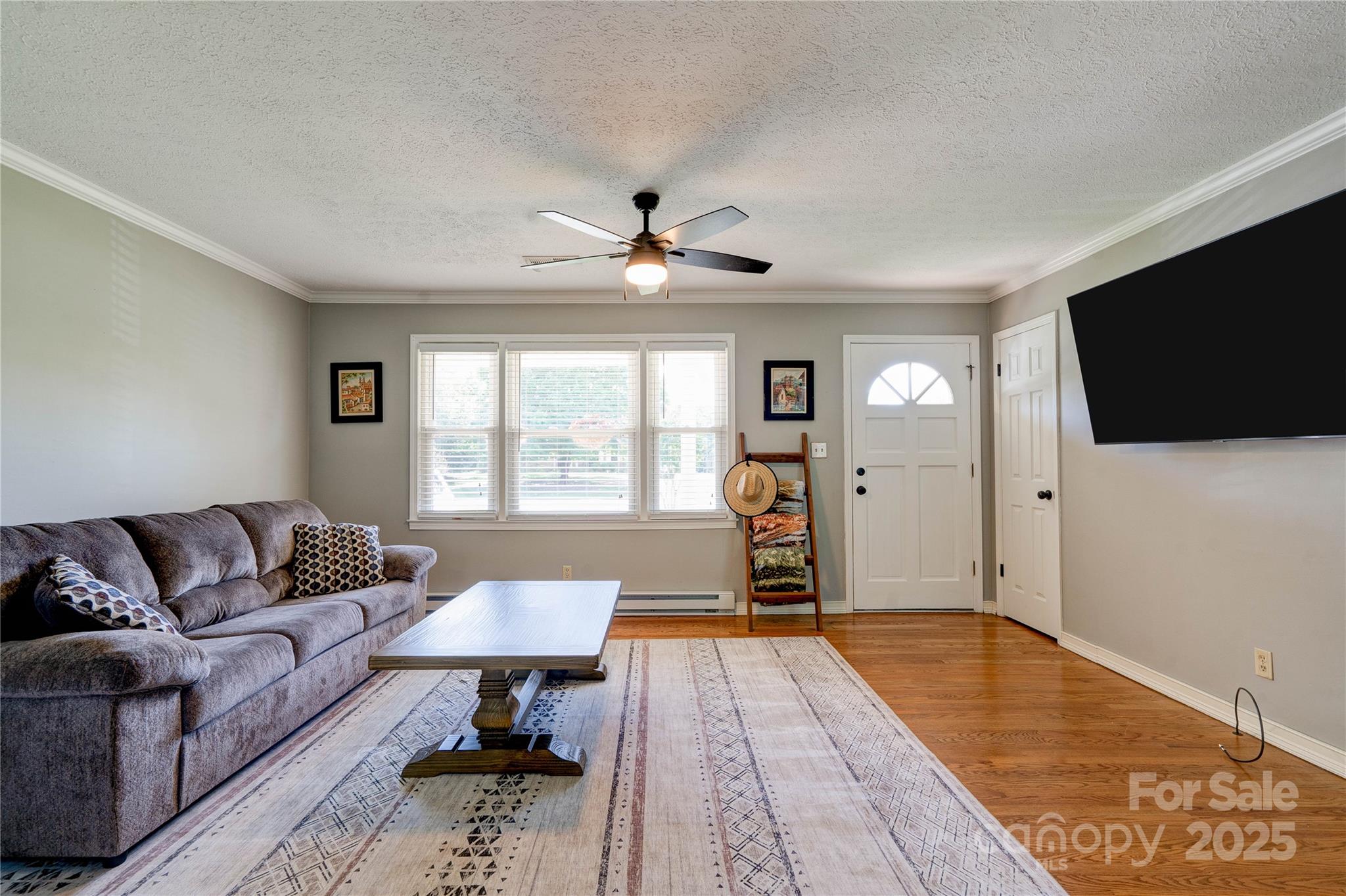 3413 Fallston Road Shelby, NC 28150 - Photo 5 of 28 a living room with furniture and a flat screen tv