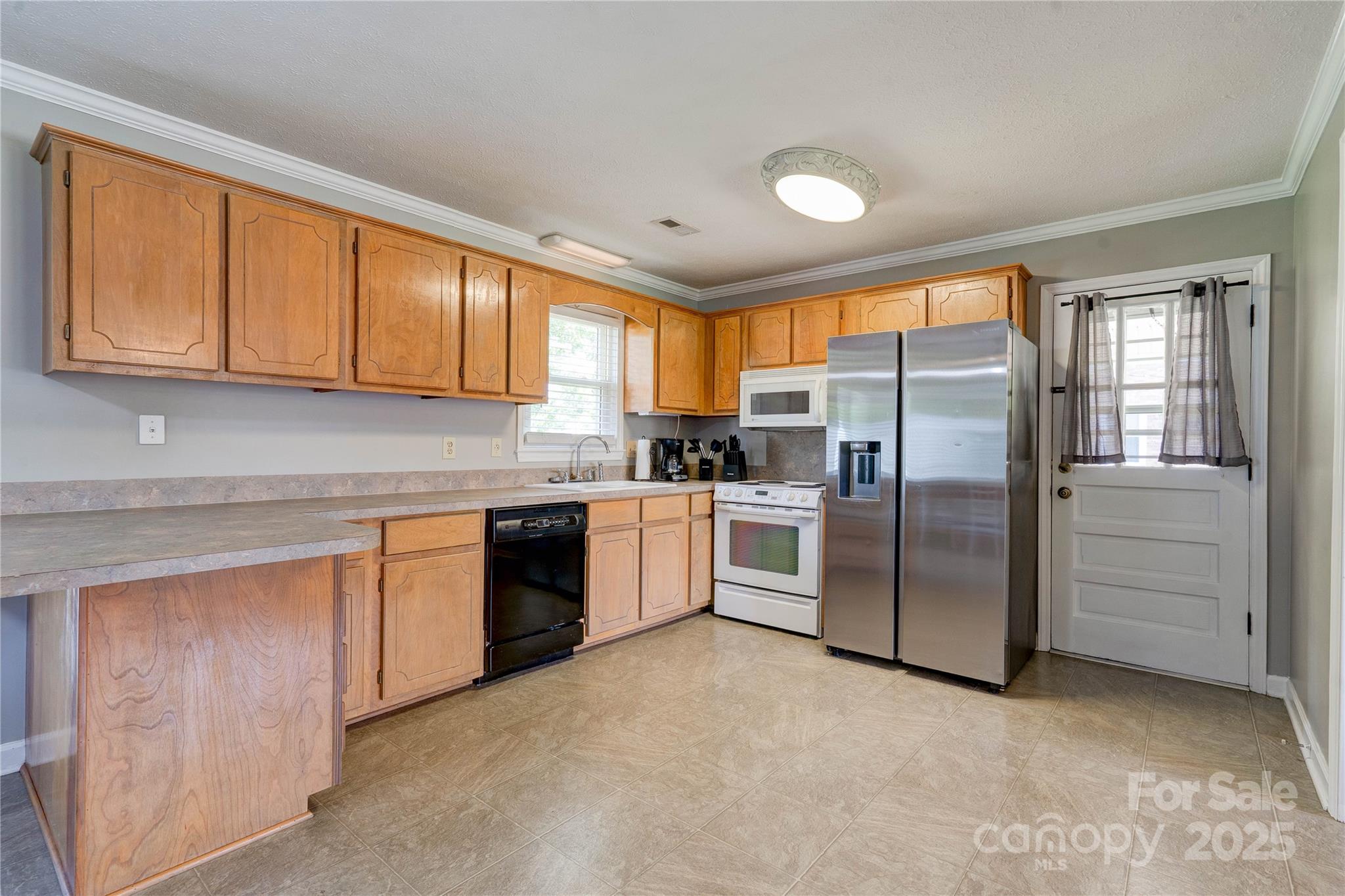 3413 Fallston Road Shelby, NC 28150 - Photo 7 of 28 a kitchen with granite countertop stainless steel appliances a refrigerator sink and cabinets