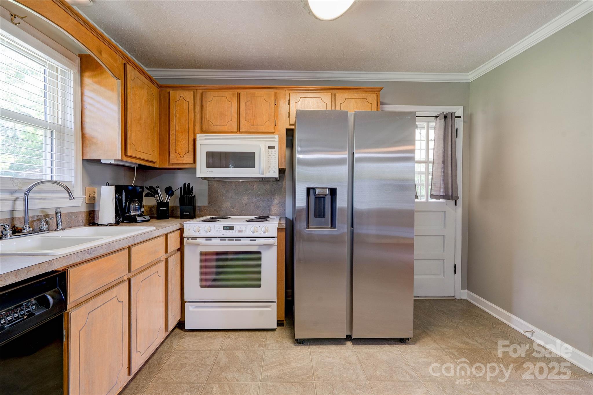 3413 Fallston Road Shelby, NC 28150 - Photo 8 of 28 a kitchen with a refrigerator sink and cabinets