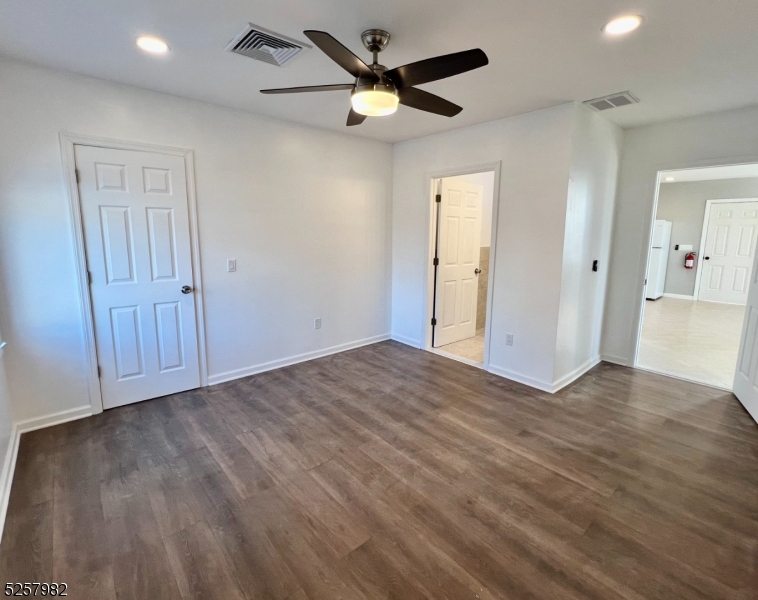 61 Mountainview Boulevard, Unit 4 Wayne, NJ 07470 - Photo 6 of 8 wooden floor in an empty room with a window