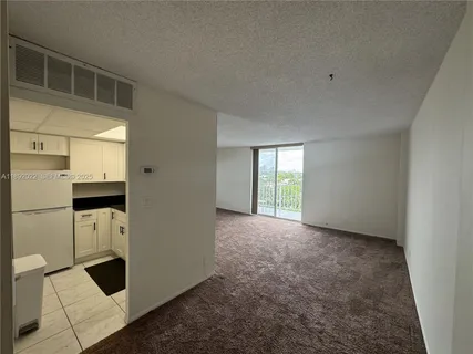 a view of empty room with windows