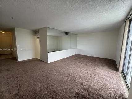 a city view from a balcony next to a lake view