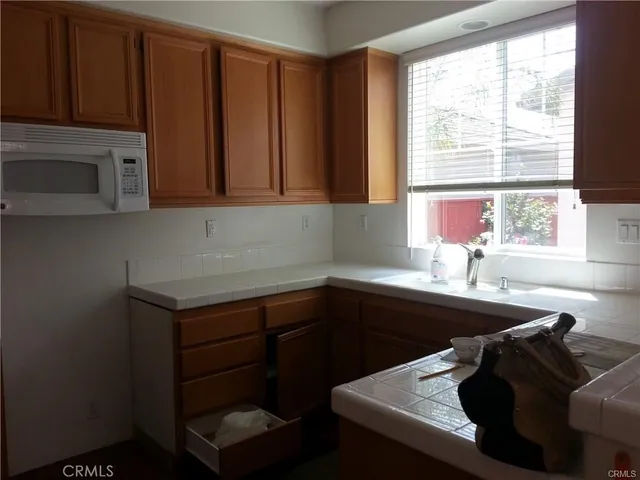 a kitchen with a sink and a window