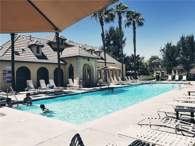a view of a house with backyard and porch