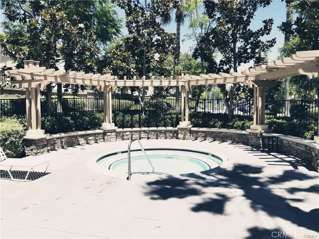 a swimming pool with outdoor seating and yard