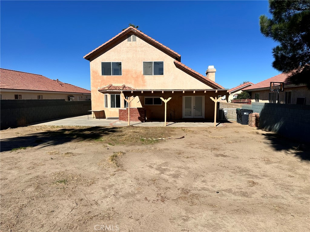 744 East Ave J11 Lancaster, CA 93535 - Photo 12 of 29 a view of a house with a wooden fence