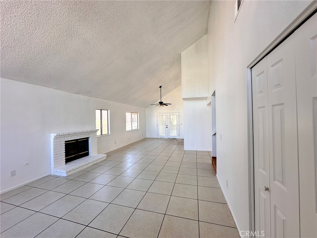 744 East Ave J11 Lancaster, CA 93535 - Photo 15 of 29 a view of a livingroom with a fireplace and window