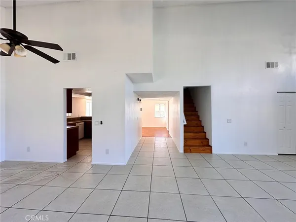 a view of an empty room and fire place
