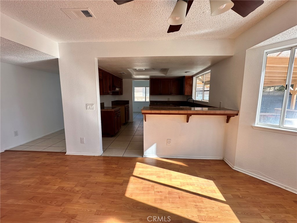 744 East Ave J11 Lancaster, CA 93535 - Photo 20 of 29 a view of a room with wooden floor and staircase