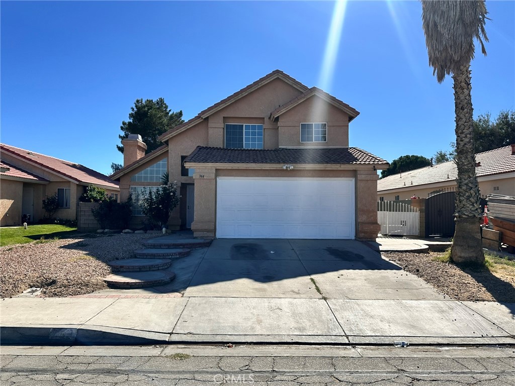 744 East Ave J11 Lancaster, CA 93535 - Photo 3 of 29 a front view of a house with garden