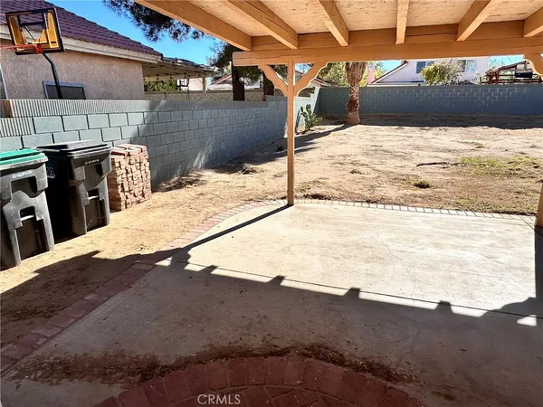 a view of a backyard of the house