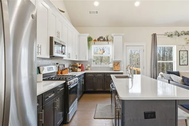 a bathroom with a sink double vanity and a mirror