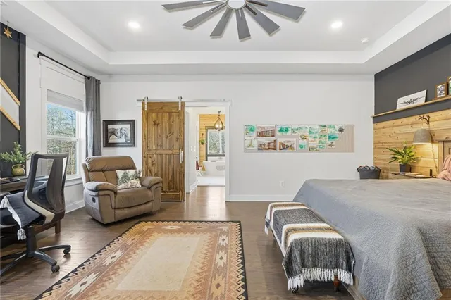 a bathroom with double vanity sink a toilet and a mirror