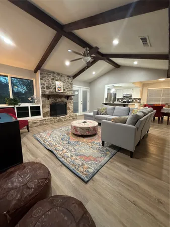 a living room with furniture and a fireplace